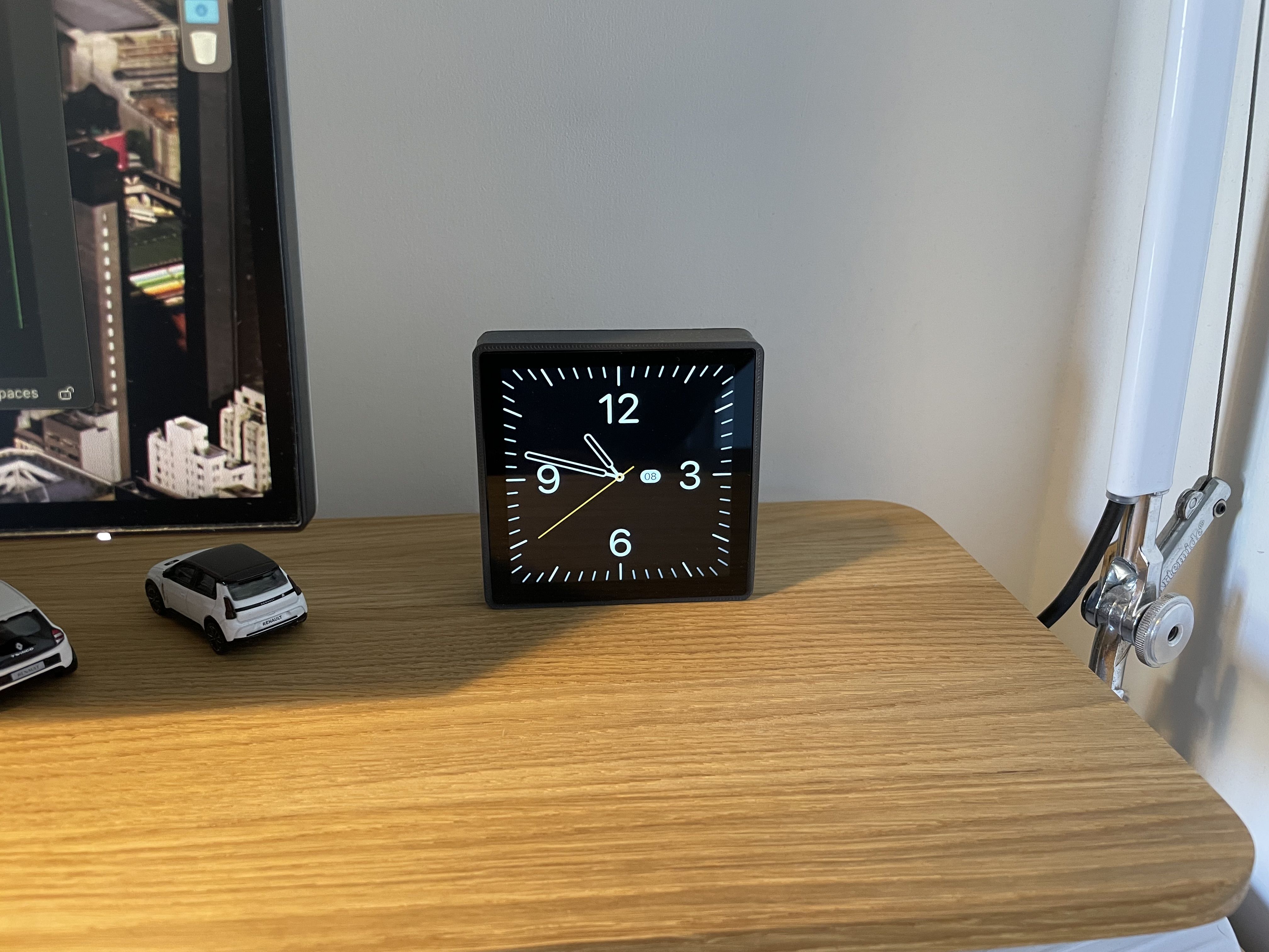 the screen on my desk showing a classic clock